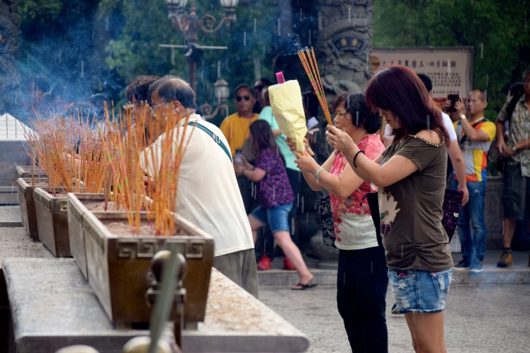 Praying at Won Tai Sin