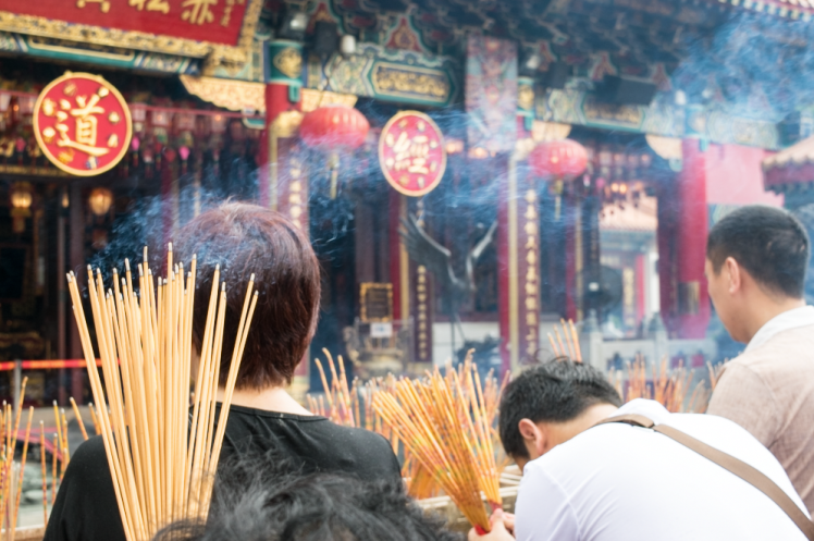 people praying at temple